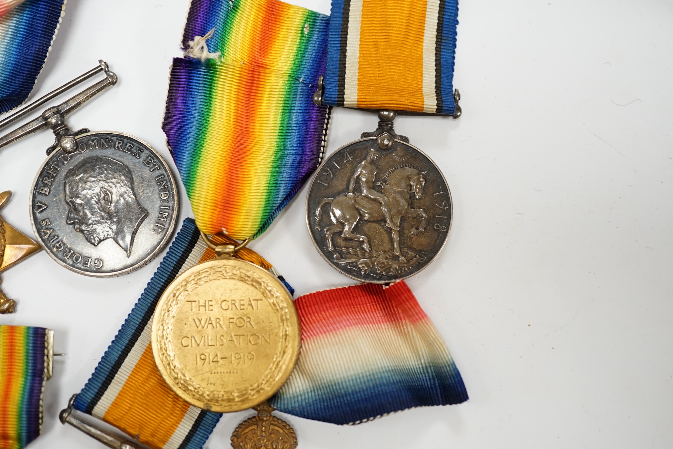 Three First World War medal trios awarded to; Pte. W.C. Belfrage 3rd Canadian MTD Rifles, Cpl. R.W. Wells R.F.A. and Pte. F.G. Walker R.A.M.C. together with two additional British war medals, two miniature metal groups,